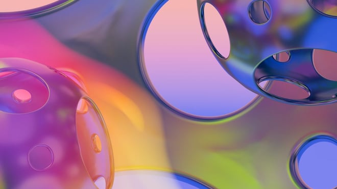Translucent overlapping spheres in pastel purple, pink and gold.